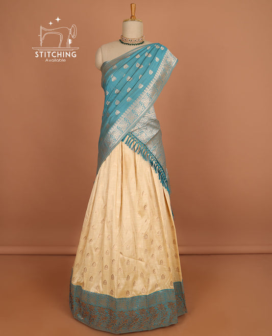 Cream floral buttas half saree with contrast zari border, zari design blouse & blue floral buttas dhavani