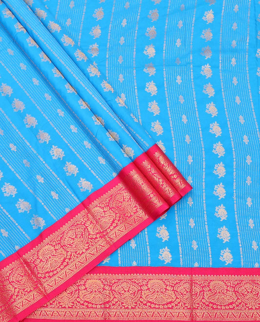 Light Blue Art Silk Pavadai Material Set, Ornamented with Zari Design on Its Skirt, Complemented by a Contrast Zari Design Border, and Paired with a Contrast Blouse