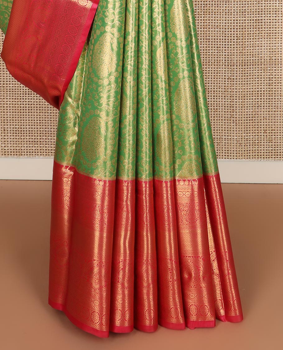 Green floral jacquard budget silk saree, contrast traditional zari border, and intricate zari woven pallu