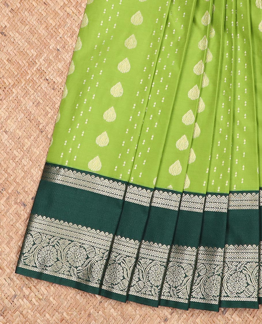 Green zari buttas gift saree, contrast rettai pettu zari border, and pallu steeped with traditional designs