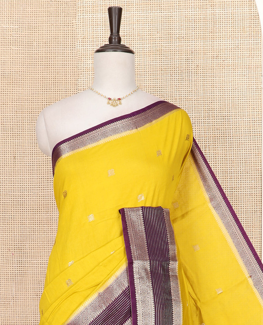 Yellow Assam Silk Saree Sparsely Woven with Peacock Buttas, Complemented by Contrast Traditional Zari Design Border, Pallu Highlighted with Zari Stripes, and Paired with a Contrast Blouse