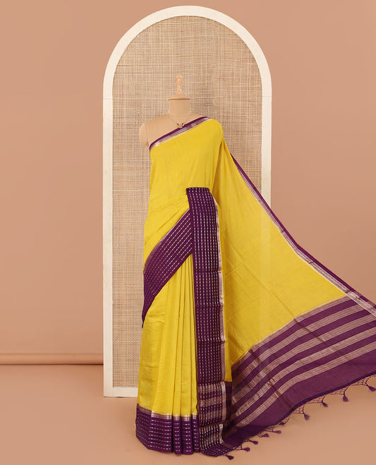 Yellow plain Assam silk saree, contrast traditional design border, and pallu of stripes