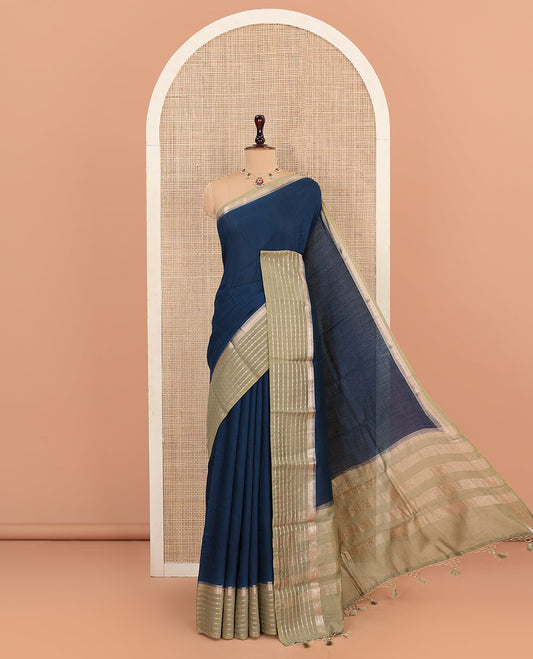 Blue Plain Assam Silk Saree, Complemented by Captivating Contrast Border Featuring Traditional Zari Designs, Gleaming Zari Woven Pallu, and Paired with a Contrast Blouse