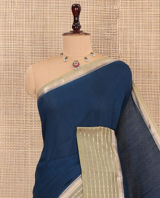 Blue Plain Assam Silk Saree, Complemented by Captivating Contrast Border Featuring Traditional Zari Designs, Gleaming Zari Woven Pallu, and Paired with a Contrast Blouse