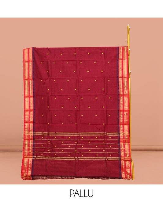 Red Chettinad Cotton Saree, Adorned with Buttas on Its Body, Complemented by a Contrast Traditional Zari Design Woven Border, Pallu of Stripes and Buttas, and Paired with a Matching Blouse