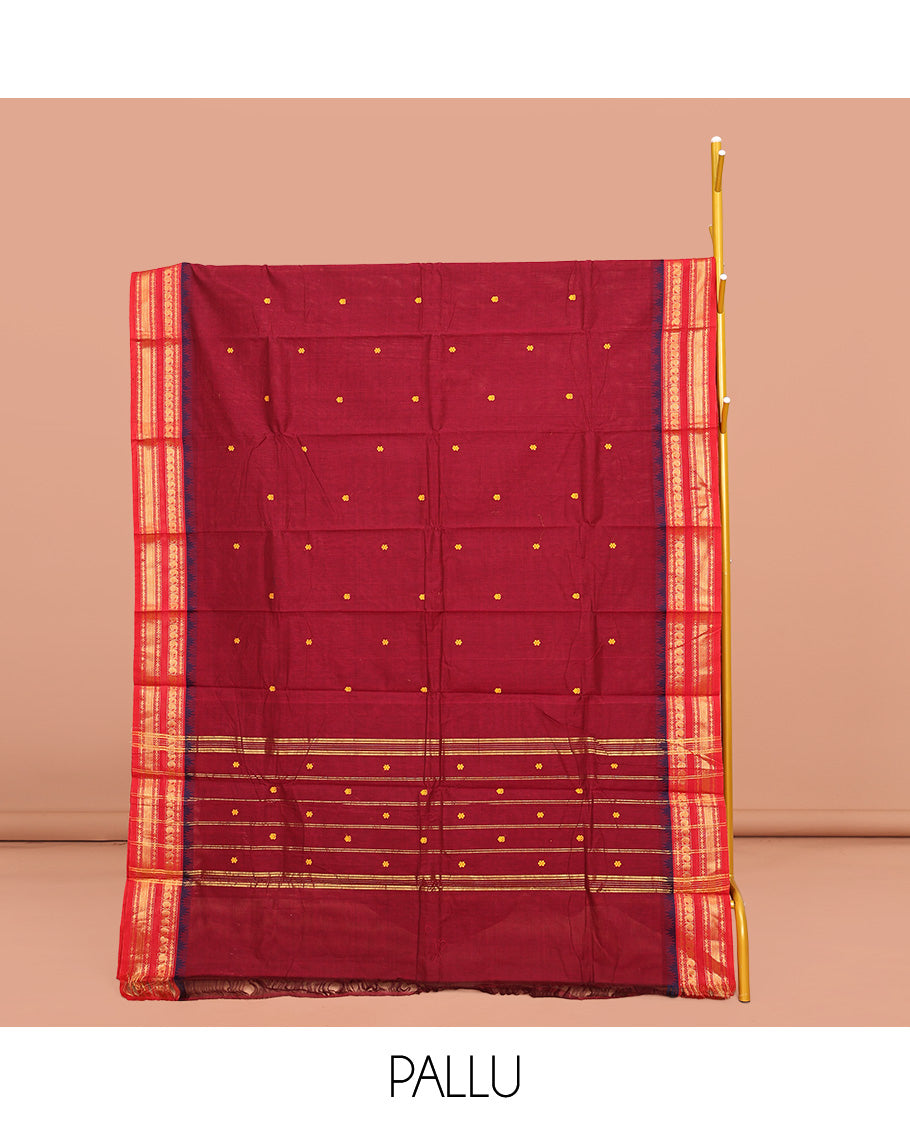 Red Chettinad Cotton Saree, Adorned with Buttas on Its Body, Complemented by a Contrast Traditional Zari Design Woven Border, Pallu of Stripes and Buttas, and Paired with a Matching Blouse