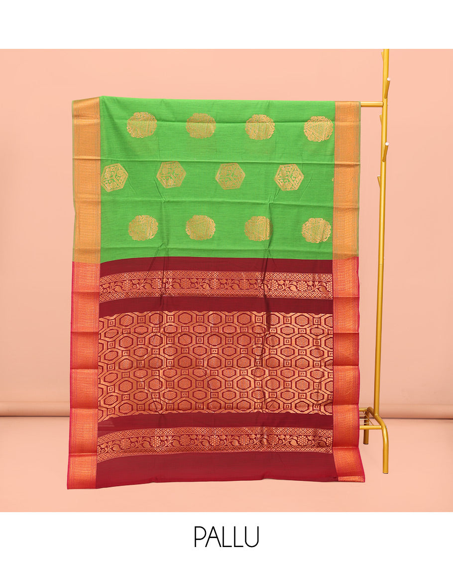 Green Semi-Silk Cotton Saree, Dazzled with Zari Buttas All Over Its Body, Highlighted by a Zari Traditional Design Border, Complemented by a Contrast Pallu of Geometric Design, and Paired with a Contrast Blouse