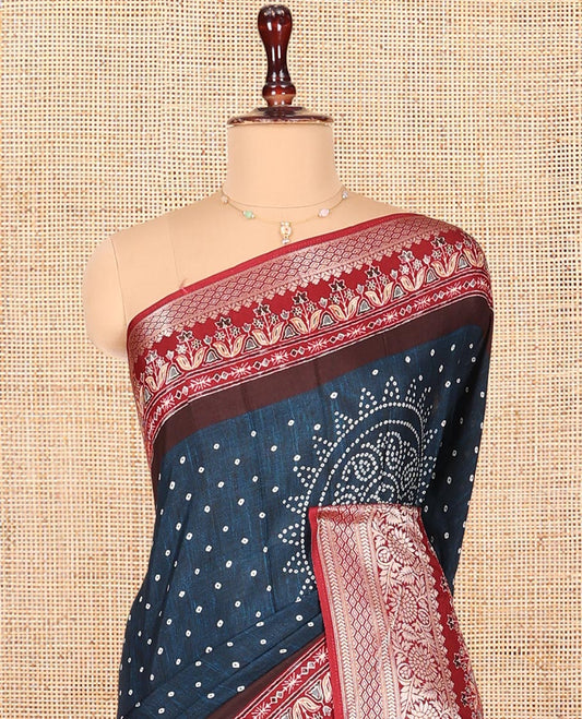 Blue Dola Silk Saree, Detailed with Bandhani Dots on Its Body, Complemented by Contrast Border, Zari Striped  Pallu, and Paired with a Contrast Blouse