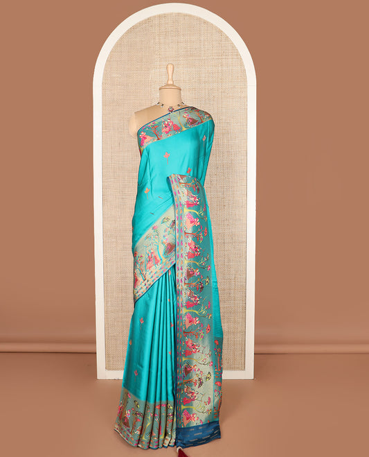 Blue unique motifs printed dola silk saree, gleaming zari border, and pallu of Mughal-style man and women motifs