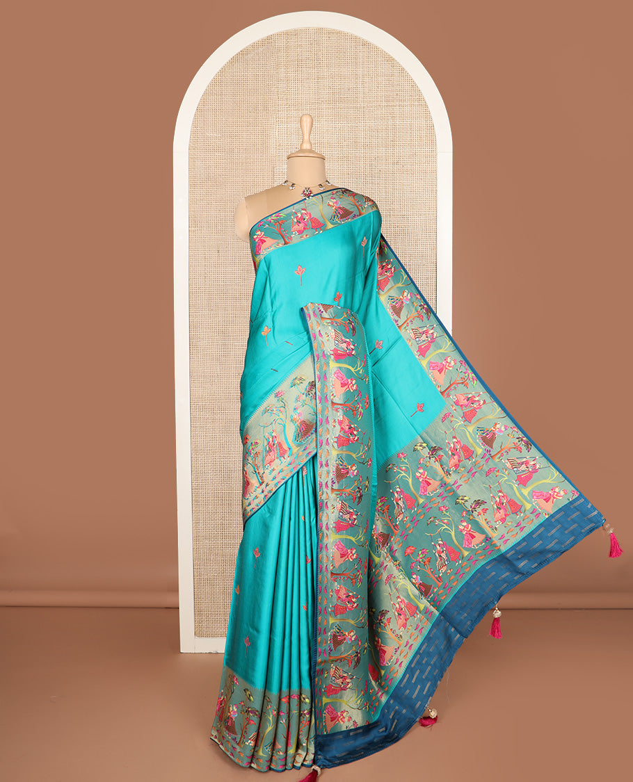 Blue unique motifs printed dola silk saree, gleaming zari border, and pallu of Mughal-style man and women motifs