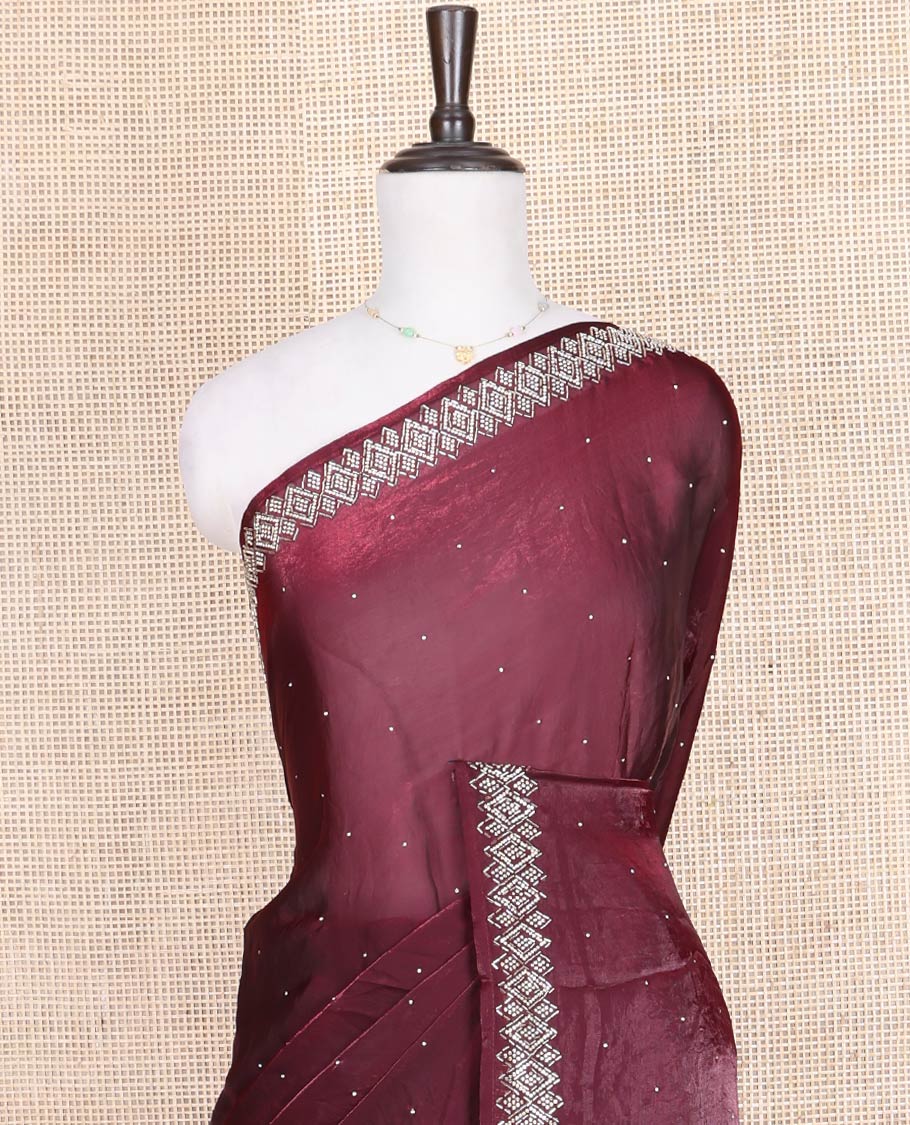 Maroon Designer Saree, Embellished with Stone Struck on Its Body, Highlighted by a Stone Embroidered Border, Self-Pallu, and Paired with a Matching Blouse