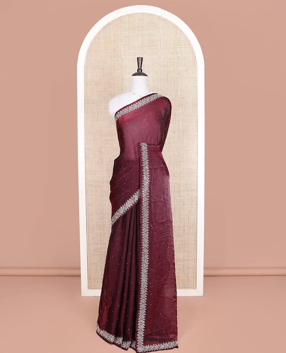Maroon Designer Saree, Embellished with Stone Struck on Its Body, Highlighted by a Stone Embroidered Border, Self-Pallu, and Paired with a Matching Blouse