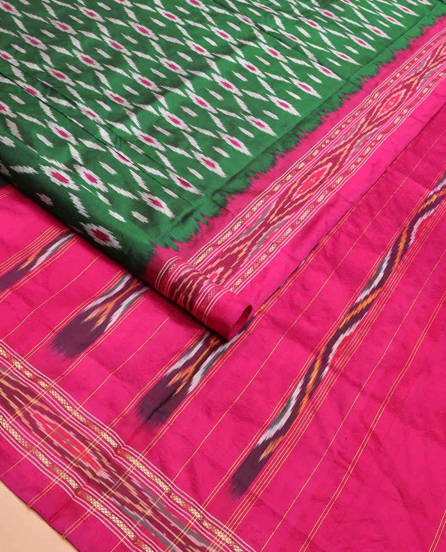 Green Ikkat Silk Saree Adorned with Geometric Patterns, Complemented with Contrast Ikkat-Textured Border, and Pallu Features Stripes and Ikkat Texture