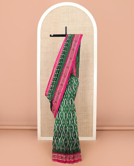 Green Ikkat Silk Saree Adorned with Geometric Patterns, Complemented with Contrast Ikkat-Textured Border, and Pallu Features Stripes and Ikkat Texture