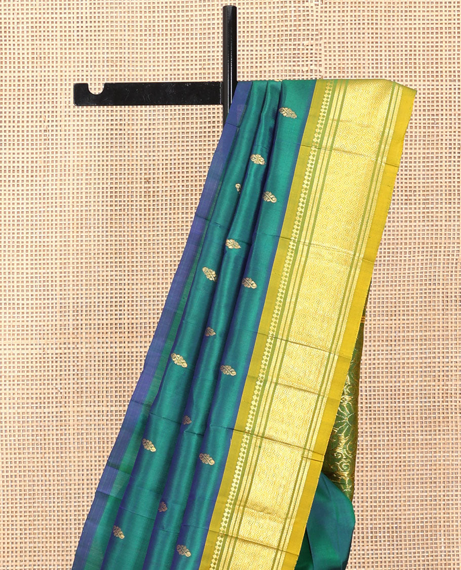 Green Kanchipuram Silk Saree, Detailed with Zari Buttas, a Contrast One-Sided Border of Panner Sombu, Banaras, and Jaal Designs, a Zari Design Pallu, and No Blouse