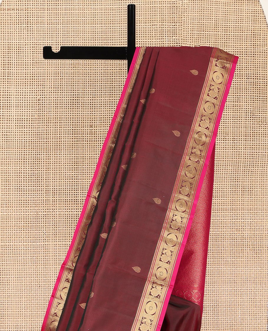 Red Wine Kanchipuram Silk Saree, Adorned with Thilakam Buttas All Over Its Body, Complemented by a Contrast Border of Rekku, Muthu, Banaras, Mayil, and Chakram Designs, Grand Jaal Pallu, and Paired with a Contrast Blouse