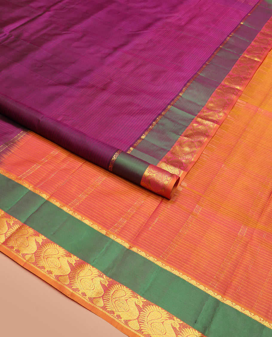 Purple Striped Kanchipuram Silk Saree Spotlighted with a Contrast Rettai Pettu Border Featuring Mayil Designs, a Subtle Striped Pallu, and a Contrast Blouse