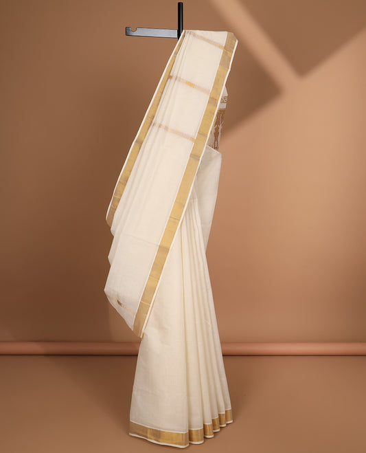Cream kerala saree with zari designs, zari border & pallu of deer designs