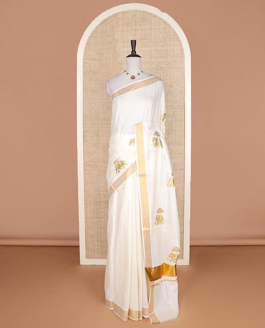 Cream elephant motifs embroidered Kerala cotton saree, zari border, and elephant motifs embroidered pallu