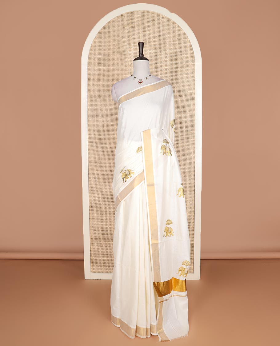Cream elephant motifs embroidered Kerala cotton saree, zari border, and elephant motifs embroidered pallu
