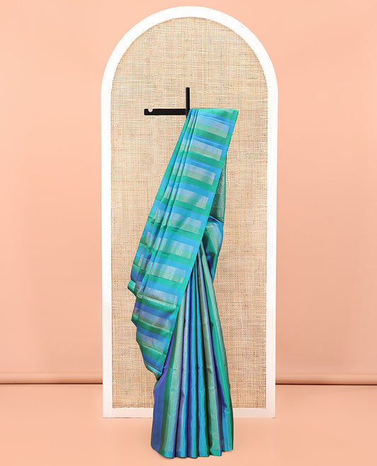 Borderless Blue Mayuri Soft Silk Saree, Adorned with Vanki Designs On Its Body, Complemented by Grandly Decked Up Pallu and Paired with a Contrast Blouse