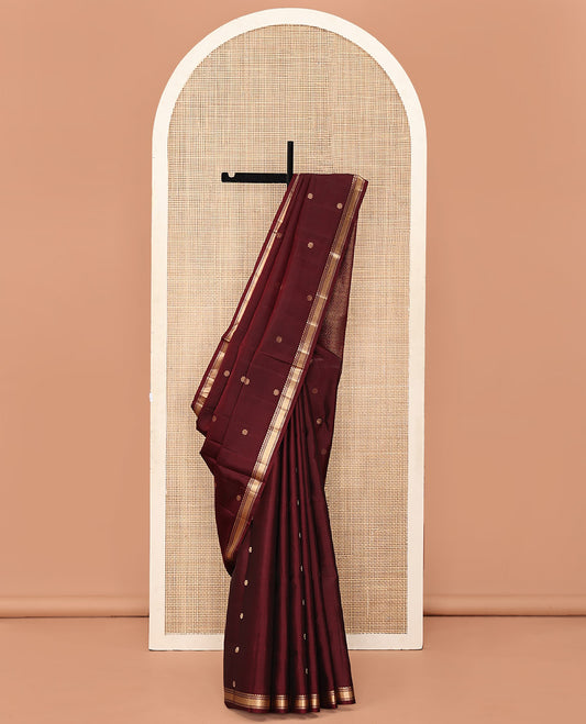 Maroon Mayuri Soft Silk Saree, Enthralled with Floral Buttas All Over Its Body, Subtly Woven Border of Salngai, Muthu, Banaras, and Kuyil Kann Designs, Sparsely Woven Jaal Pallu, and Paired with a Matching Blouse