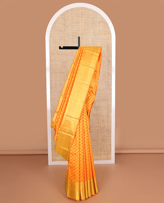 Orange checkered silk saree with self zari  border of thilakam mokku, poo chakram, banaras design & zari design pallu