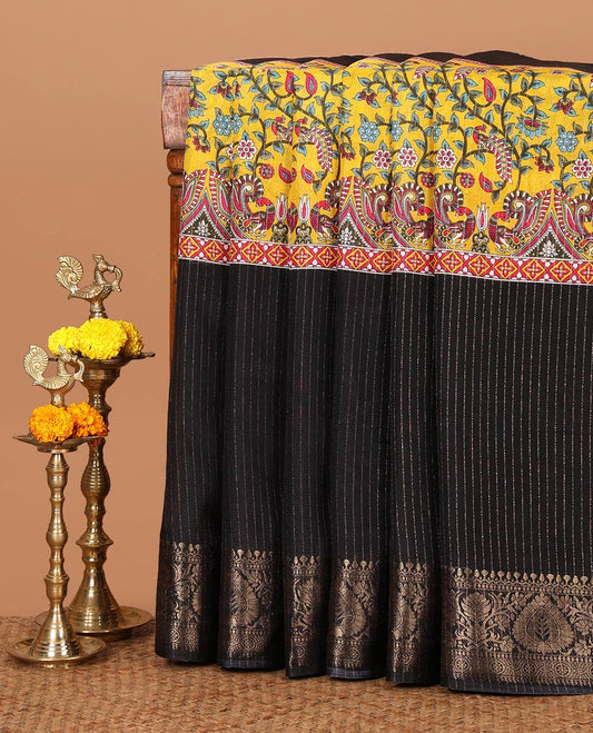Black and gold dola silk saree with zari stripes and kalamkari-theme motifs printed on its center of the body, golden zari jacquard border & zari design blouse