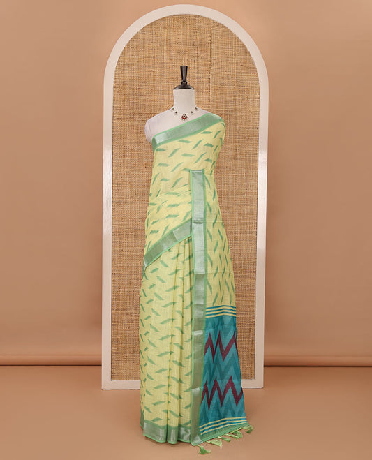 Lemon yellow ikkat digitally printed linen saree, contrast zari bavanji border,chevron ikkat printed pallu & ikkat jaal printed contrast blouse