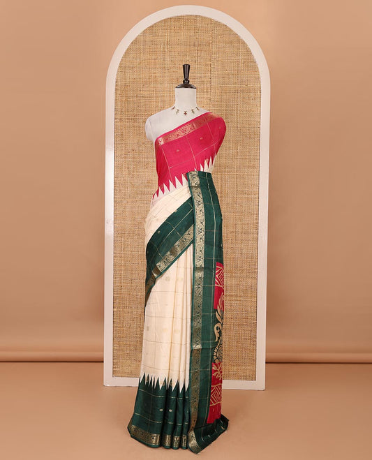 Cream zari buttas enclosed checked dola silk saree, contrast ganga jamuna temple peacock motifs border, floral-paisley printed pallu & contrast zari design blouse
