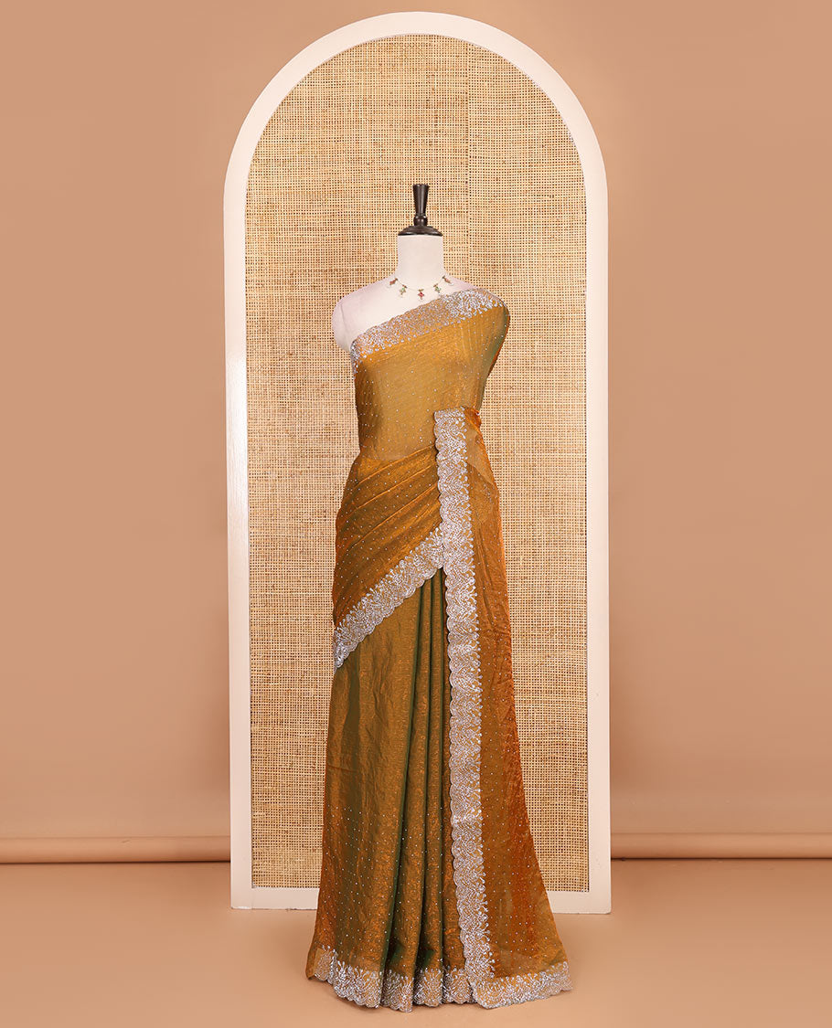 Mustard Swarovski crystal stone embedded fendy chiffon saree, scallop border accentuated with floral and scallop design in Swarovski stones