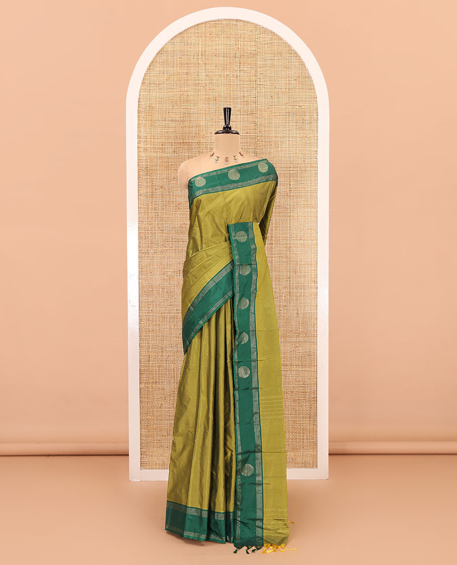 Olive Green dobby style buttas semi-soft silk saree, contrast round buttas and striped border, striped pallu, and a plain blouse
