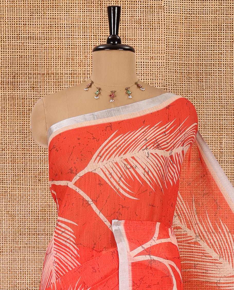 Peach tropical leaf motifs batik printed linen cotton saree, piping border, batik printed pallu and a contrast batik printed blouse
