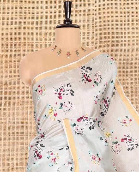 Grey Banana Pith Saree Prettified with Multi-Color Floral Vine Print, Subtle Small Bavanji Border, Gleaming Zari Striped Pallu, and Complemented with a Contrast Floral-Printed Blouse