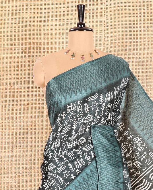 Green Art Khadi Cotton Saree Adorned with Warli-Village Theme Print, Complemented with a Contrasting Chevron-Printed Border, Vibrantly Warli-Printed Pallu, and a Plain Blouse
