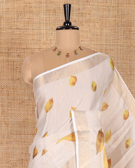 Cream Tissue Saree, Adorned with Dried Leaf Motifs Printed All Over Its Body, Subtle Bavanji Border, Pallu Features a Leaf Print, and Paired with a Matching Dried Leaf Printed Blouse
