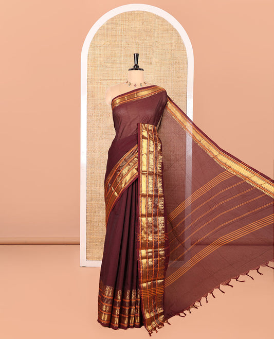 Coffee Brown Plain Chettinad Cotton Saree, Highlighted by Sparkling Traditional Zari Border of Peacock and Rudraksham Designs, Subtly Striped Pallu, and Paired with a Matching Blouse