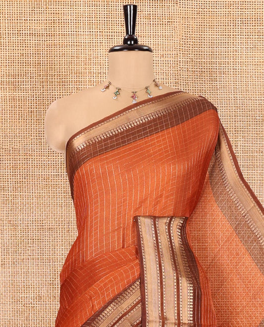 Rust Orange Moss Chiffon Saree, Embellished with Zari Checks All Over Its Body, Complemented by a Contrast Traditional Zari Design Border, Zari Striped Pallu, and Paired with a Contrast Blouse
