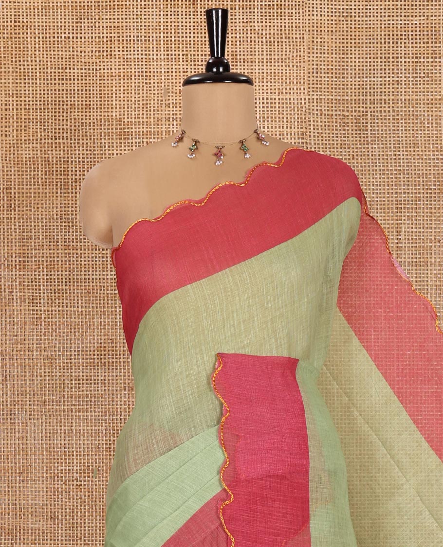 Green Plain Linen Cotton Saree, Complemented by Contrast Scallop Border, Plain Pallu, and Paired with a Contrast Floral Printed Mirror Embroidered Blouse
