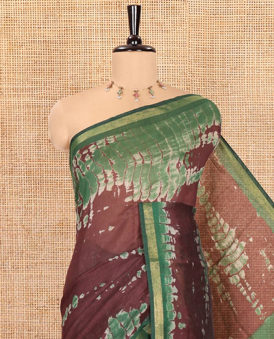 Brown Muslin Cotton Saree, Adorned with Marble-Textured Shibori Printed All Over Its Body, Subtle Piping Border, Pallu of Shibori Print, and Paired with a Contrast Blouse