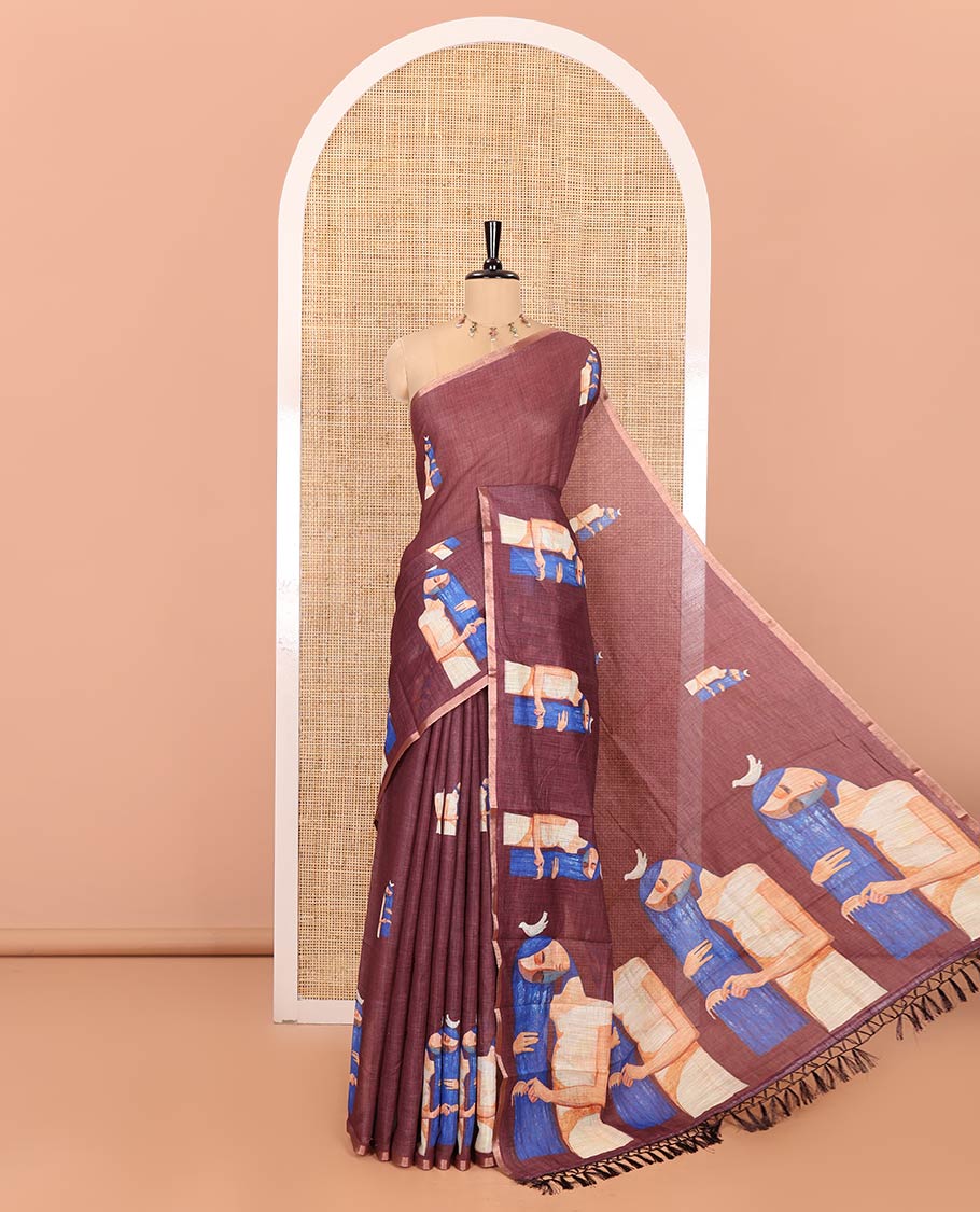 Maroon Linen Saree, Bedecked with Woman Braiding Her Hair Motifs Printed on Its Body, Subtle Zari Piping Border, Pallu Mirrors the Same Print, and Comes with a Matching Printed Blouse