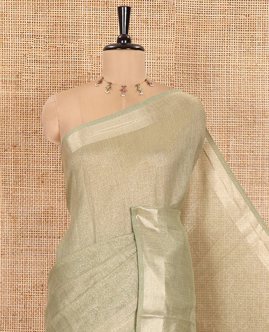 Pale Green Tissue Saree, Gleamed Up with Zari Striped on Its Body, Highlighted by a Zari Border, Pallu Steeped with Zari Stripes, and Paired with a Matching Blouse