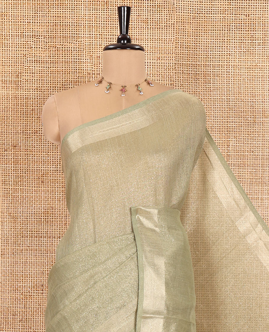 Pale Green Tissue Saree, Gleamed Up with Zari Striped on Its Body, Highlighted by a Zari Border, Pallu Steeped with Zari Stripes, and Paired with a Matching Blouse