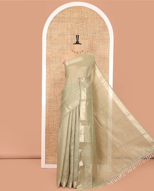 Pale Green Tissue Saree, Gleamed Up with Zari Striped on Its Body, Highlighted by a Zari Border, Pallu Steeped with Zari Stripes, and Paired with a Matching Blouse