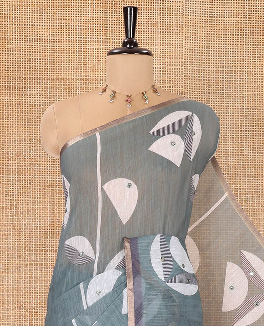 Green Linen Saree, Elevated with Geometric Print and Mirror Work on Its Body, Subtle Piping Border, Pallu Steeped with Geometric Patterns, and Paired with Unique Motifs Printed Contrast Blouse