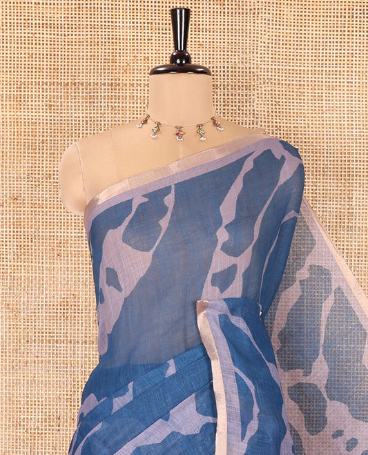 Grey Linen Cotton Saree, Adorned with Shibori Prints on Its Body, Subtle Contrast Piping Border, Pallu of Floral Print, and Paired with a Matching Blouse