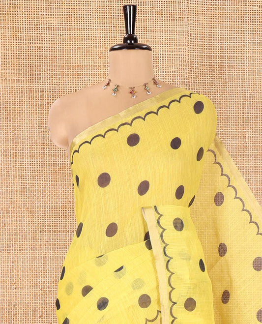 Yellow Linen Cotton Saree, Beautified with Polka Dots All Over Its Body, Subtle Piping Border, Self-Pallu, and Paired with a Floral Printed Matching Blouse