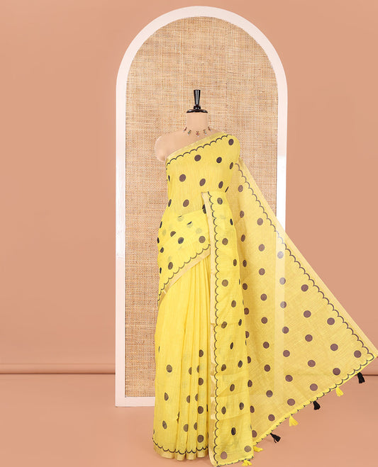 Yellow Linen Cotton Saree, Beautified with Polka Dots All Over Its Body, Subtle Piping Border, Self-Pallu, and Paired with a Floral Printed Matching Blouse