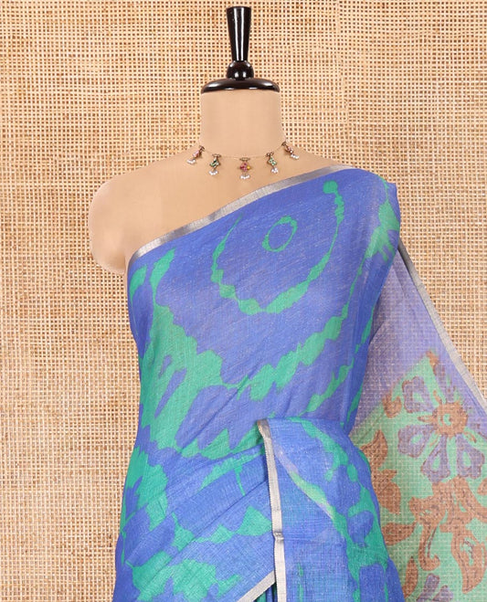 Royal Blue Linen Cotton Saree, Embellished with Shibori Printed on Its Body, Subtle Piping Border, Pallu Features Floral Print, and Paired with a Contrast Floral Printed Blouse