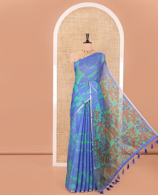 Royal Blue Linen Cotton Saree, Embellished with Shibori Printed on Its Body, Subtle Piping Border, Pallu Features Floral Print, and Paired with a Contrast Floral Printed Blouse